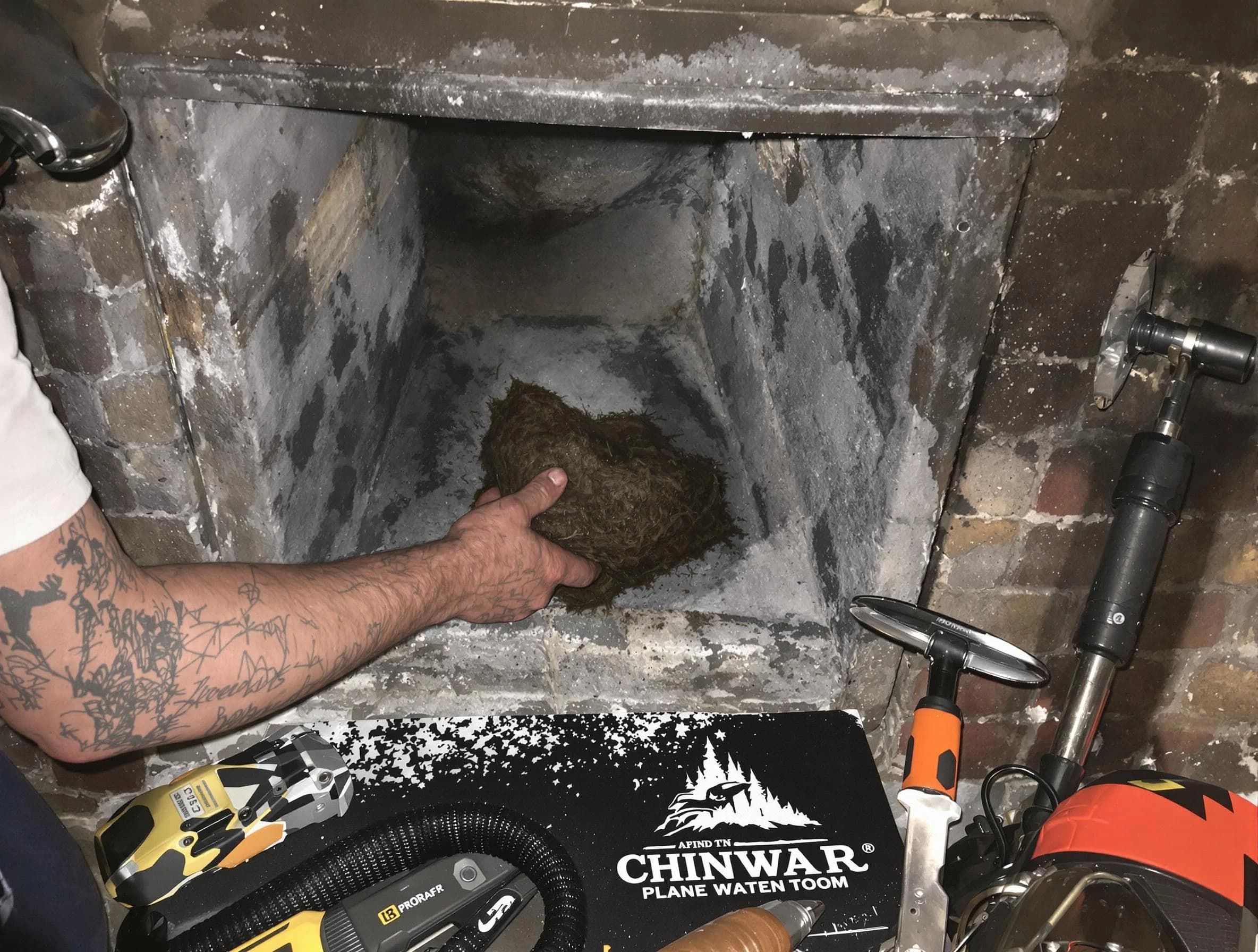 Hingham Chimney Sweep safely removing debris and screening chimney in Hingham, MA